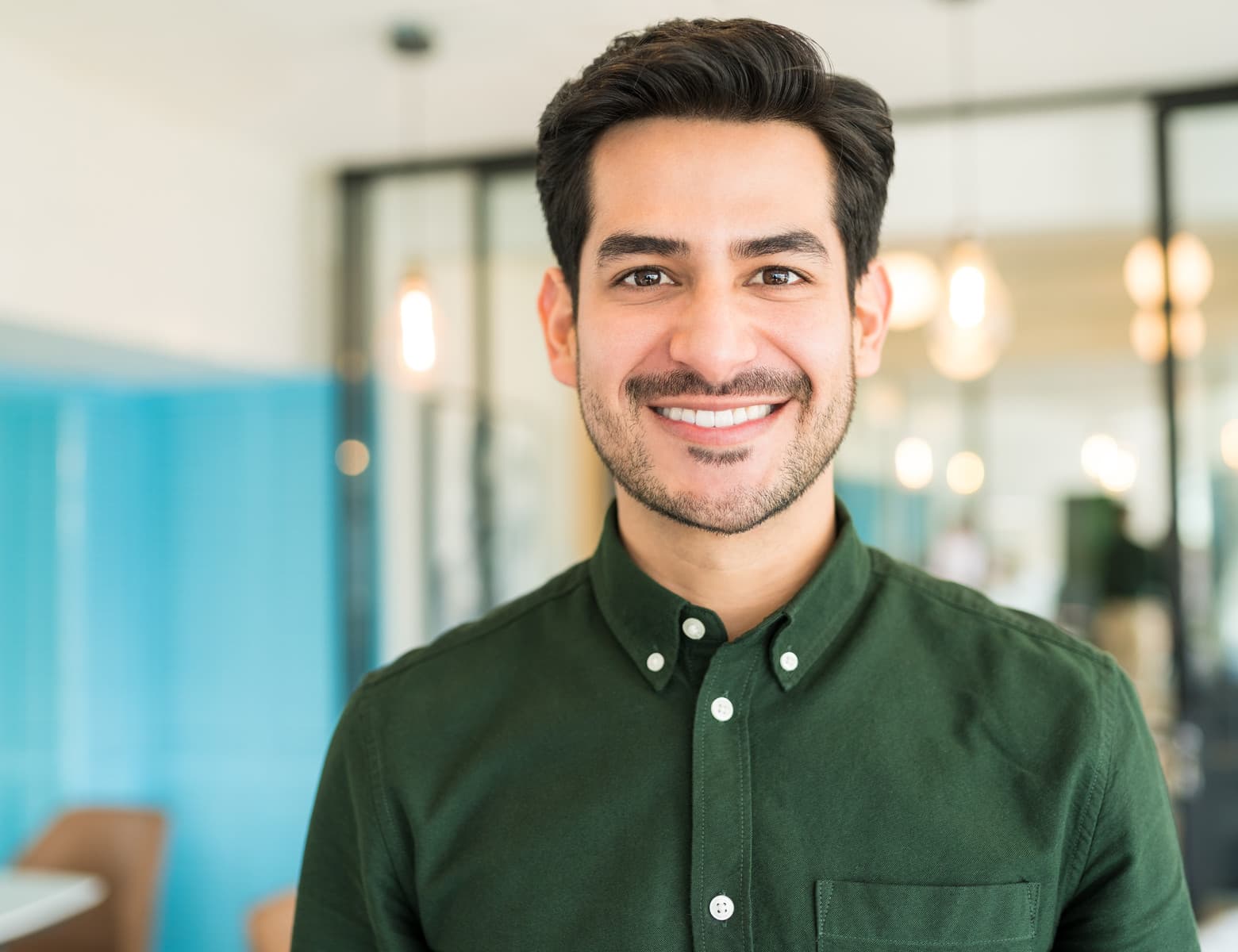 A man smiling in an office