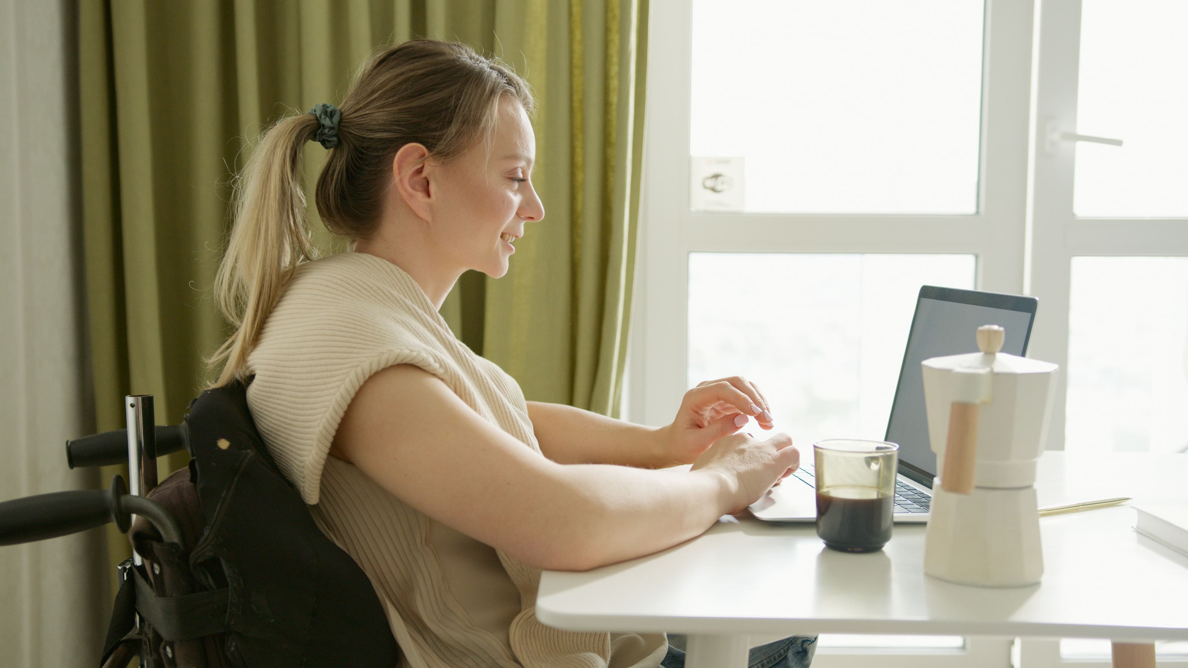 Woman participating in a virtual coaching session with a professional coach.