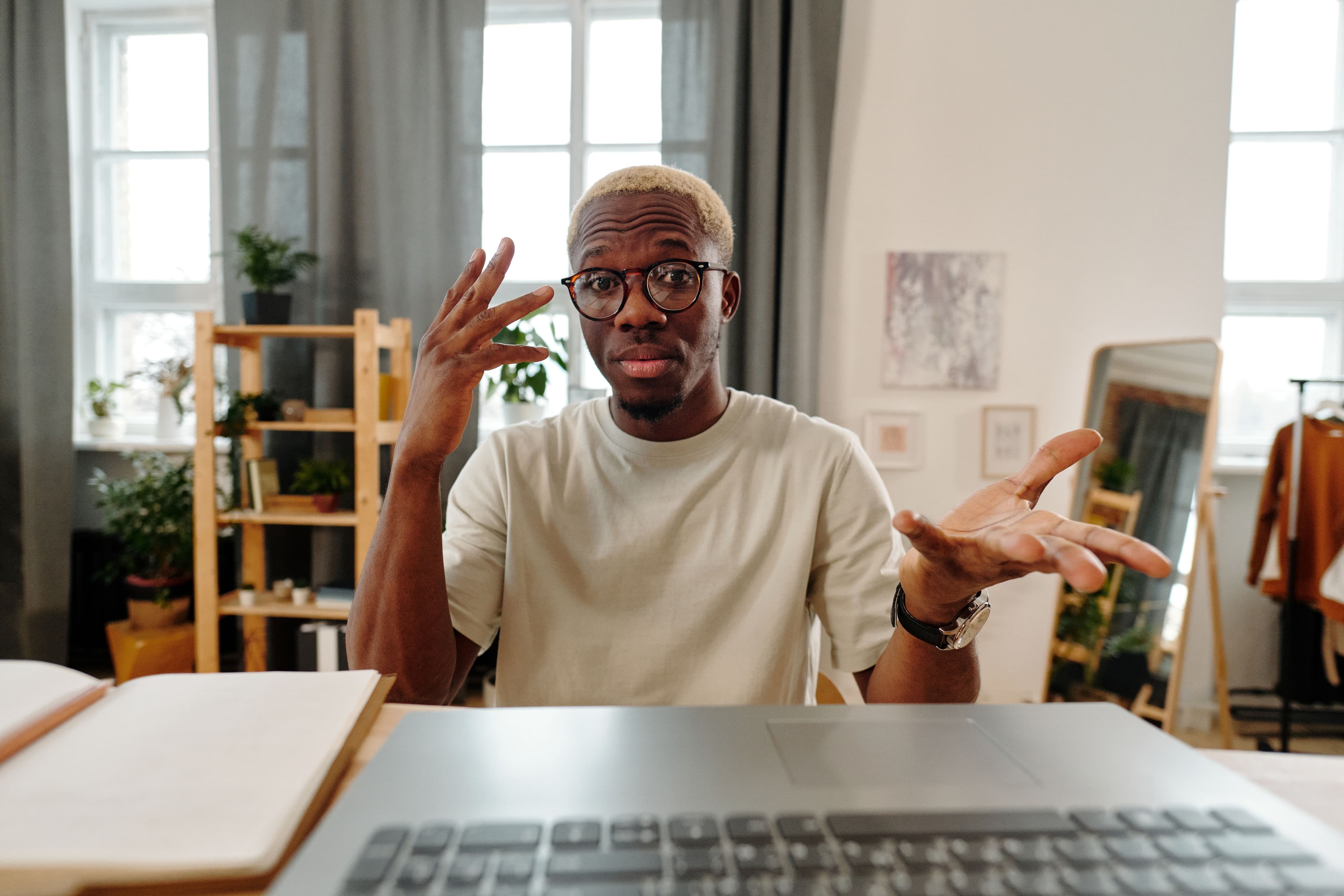 A person participating in a virtual coaching session with a professional coach.
